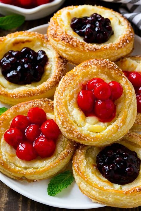 It only takes about 10. Cream cheese danish topped with cherries and blueberries ...
