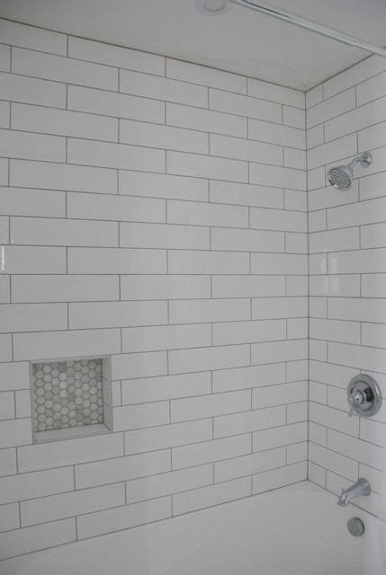 Subway tiles laid out in a herringbone pattern can give the space above your countertops a sharp yet uplifting feel! Shower Design: Subway Tile and Marble Tile Niche | Tile ...