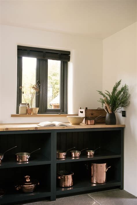 The Perfect Combination Warm Copper Pans And Devol Open Base Cabinets