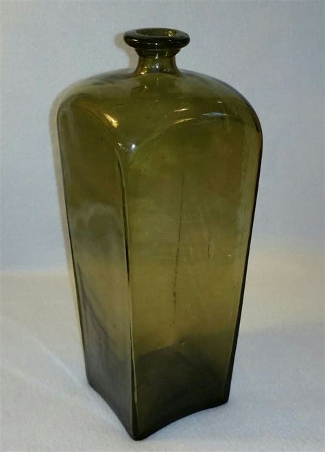 18th century english or dutch free blown glass olive green gin bottle with applied tooled lip