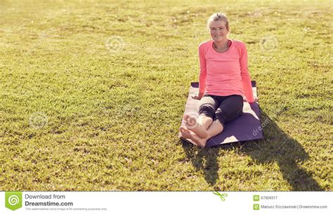 Sporty Senior Woman Sitting On A Yoga Mat Oudoors Stock Image Image