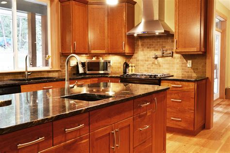 Cherry kitchen cabinets with granite countertops. Cherry cabinets, light wood floor with light countertops. Description from pintere… | Cherry ...