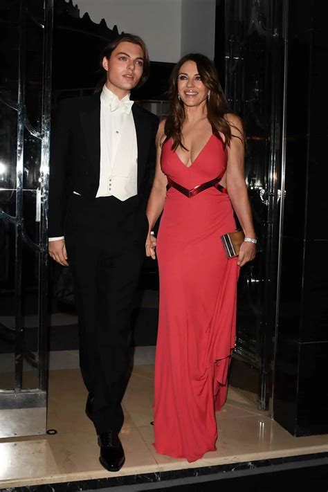 Elizabeth Hurley Stuns In A Red Dress At Joan Collins 88th Birthday