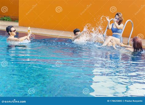 Cheerful People Splashing Water In Swimming Pool Stock Image Image Of Lifestyle Caucasian