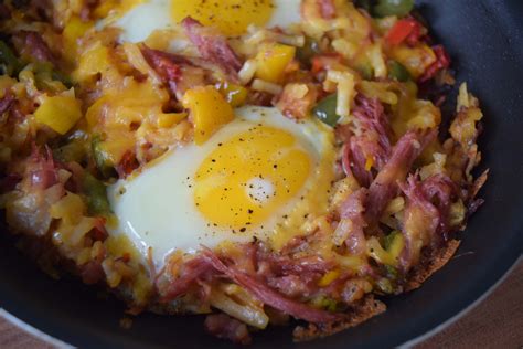 In a skillet, melt butter over medium heat. corned beef hash and eggs