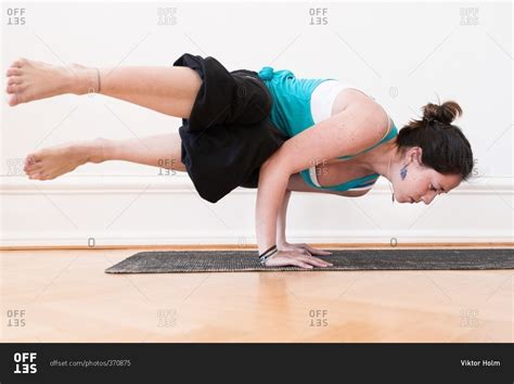 Woman In An Advanced Horizontal Handstand Yoga Pose Stock Photo OFFSET