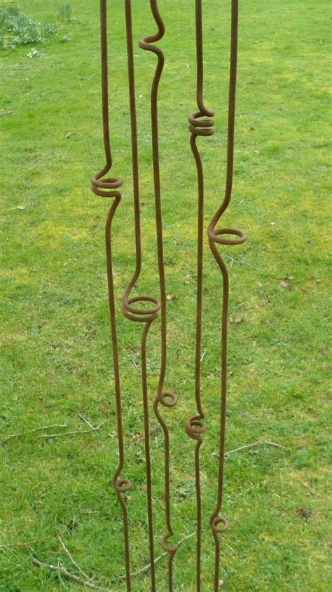 Check out our metal plant supports selection for the very best in unique or custom, handmade pieces from our outdoor & gardening shops. "Loopy" Plant Stakes | Metal garden ornaments, Metal garden art, Rusty garden