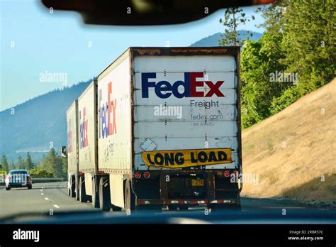 FedEx Freight LTL Shipping delivery truck with triple trailers and a