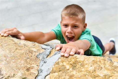 Child Athlete Falls Off A Cliff Danger Of Falling From A Hill Climb A