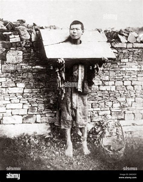 Man In A Cangue Punishment China Circa 1880s Stock Photo Alamy