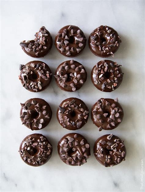 Baked chocolate donuts start out with a cake mix and are the perfect excuse to enjoy chocolate for breakfast or as a snack any time of day! Triple Chocolate Baked Donuts- The Little Epicurean