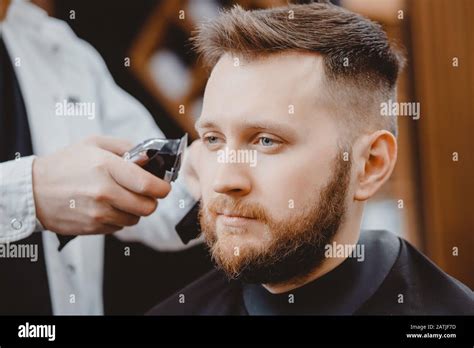 Hairdresser Cuts Hair Men In Barbershop Barber Doing Correct Beard