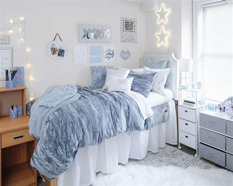 A Bedroom With White And Blue Decor On The Walls