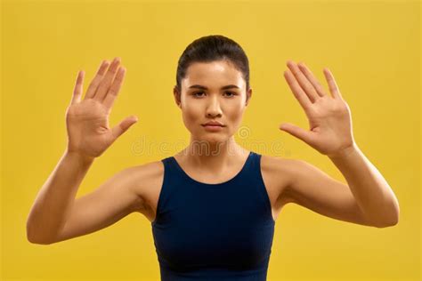 Pretty Girl Raising Hands Holding Palms Looking At Camera Stock Image Image Of Stretching