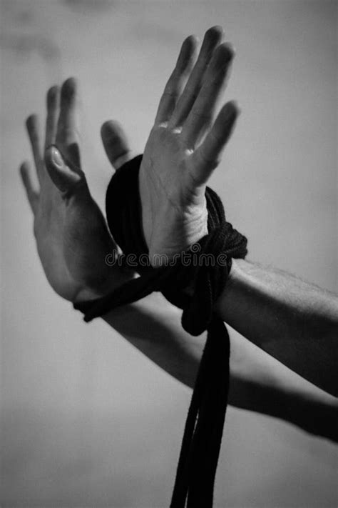 A Man Holds Black Shibari Ropes In His Hand Stock Photo Image Of Dark