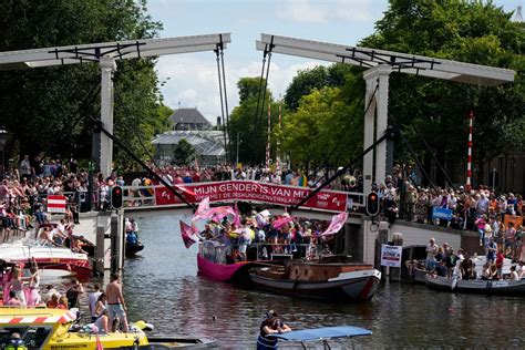huge crowds watch amsterdam pride s canal parade celebration