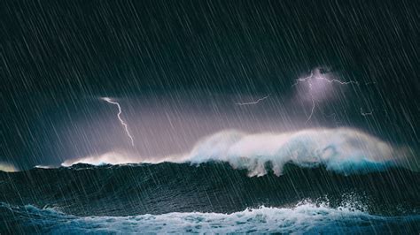 Thunderstorm In The Sea With Big Waves And Lightning Stock Photo