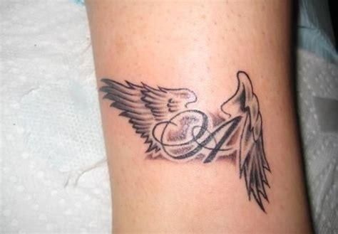 Word And Wings Tattoo Wing Tattoos On Wrist Beautiful Angel Tattoos