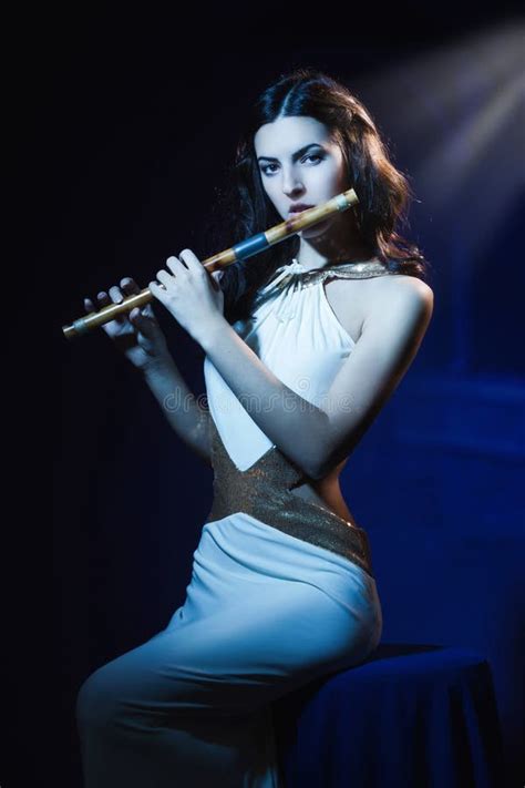 Portrait Of A Woman Playing Transverse Flute Stock Photo Image Of