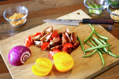 Chopped Vegetables On Cutting Board Stock Photo Dissolve