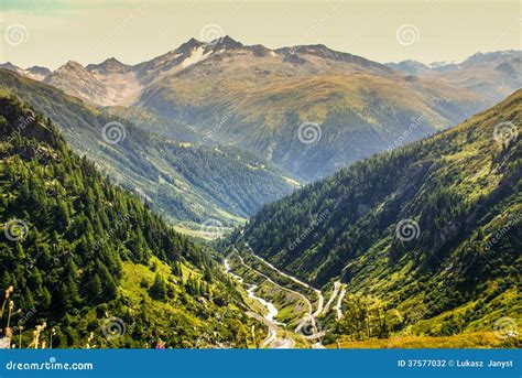 View Through Alps Valley Near Gletch With Furka Pass Mountain Road