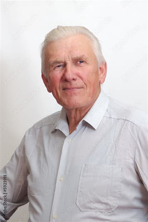70 Year Old Man Looking Into The Camera With A Smile On His Face Stock