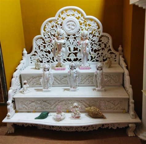 Engineered wood, plywood, solid surfaces, texture finishes etc. Mandir singhasan in white marble | Temple design for home ...