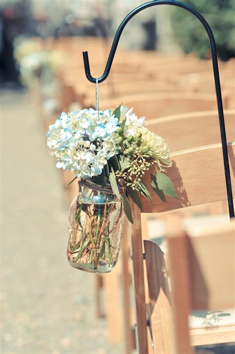 Mason Jars And Flowers Used As Wedding Aisle Decor Wedding Aisle