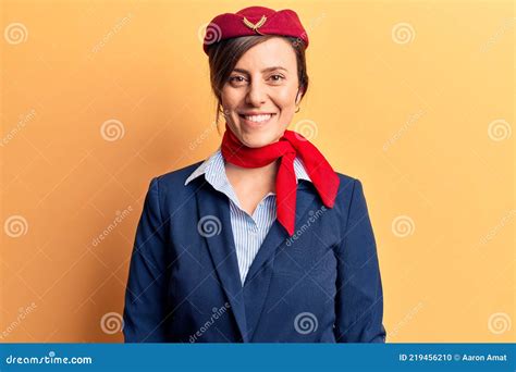 Young Beautiful Woman Wearing Stewardess Uniform With A Happy And Cool