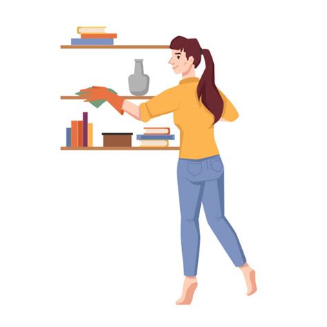 A Woman Dusting Her Book Shelf Stock Photos Pictures And Royalty Free