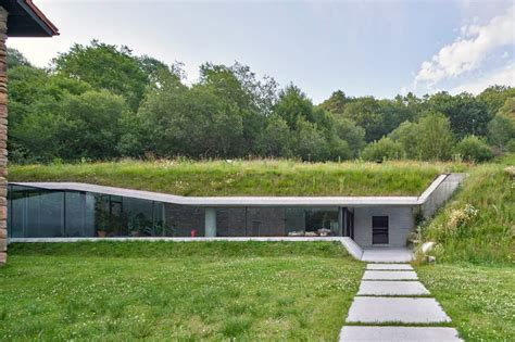 A Sleek Glass And Concrete Addition Built Into A Hill House Built