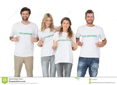 Group Portrait Of Happy Volunteers Pointing To Themselves Stock Image