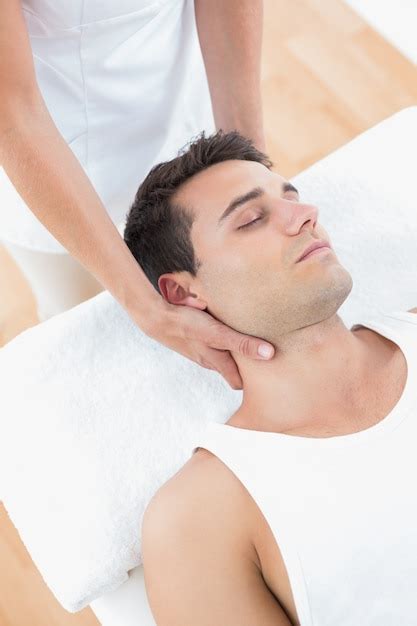 Premium Photo Man Receiving Neck Massage