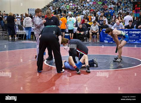 Medical Doctor Looks At Injured Wrestler At Tournament Of Champions