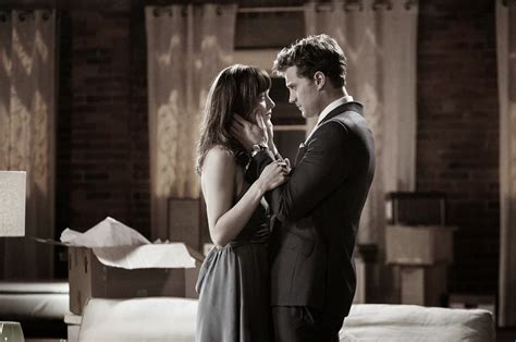 fifty shades updates hq photo new still from fifty shades of grey featuring ana and christian