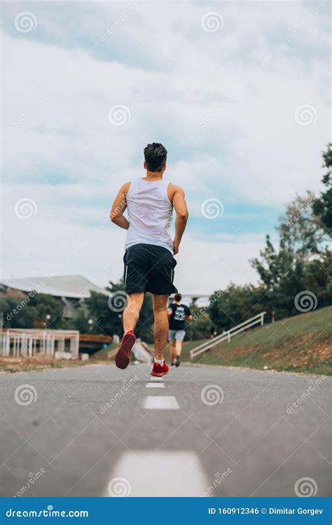 Young Man Running On The Street Stock Photo Image Of Morning Active