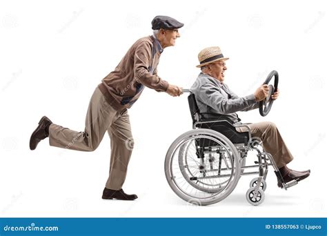 Elderly Man Pushing A Man Sitting In A Wheelchair And Holding A
