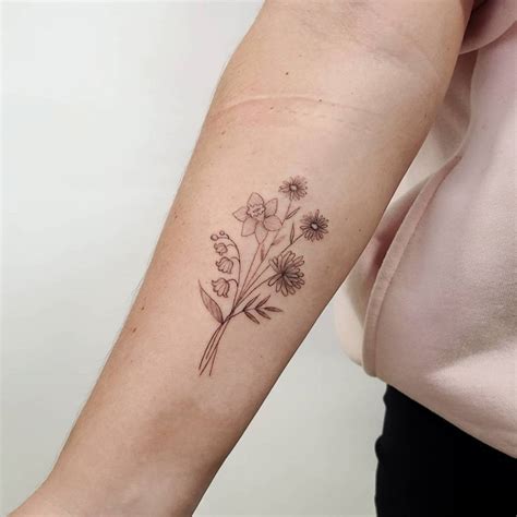 Fine Line Flower Bouquet Tattoo Placed On The Inner