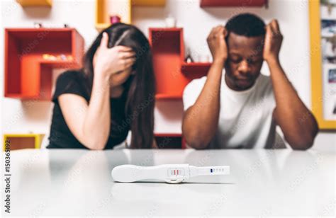 Positive Test For Pregnancy Disappointment And Frustrated Young Interracial Couple Black Man