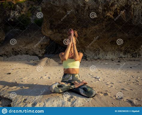 Meditation On The Beach Beautiful Woman Sitting On The Sand In Lotus Pose Padmasana Stock