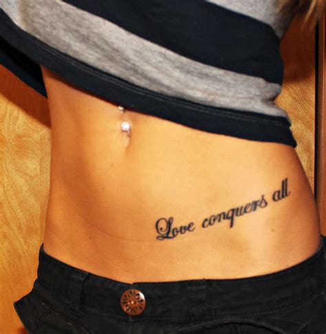 To have the best person at your side at all times deserve a dedication tattoo as a sign of friendship. My first tattoo! Love conquers all tattoo quote hip tattoo | Hip tattoo, Foot tattoos, Tattoos ...