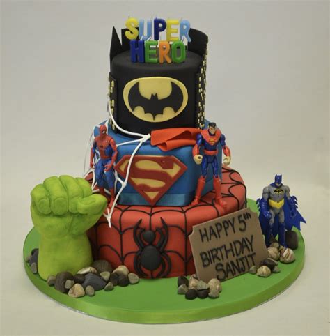Tasty birthday cupcake with candle on table against blurred lights. 3 Tier Super Hero Cake with Figures - Boys Birthday Cakes ...