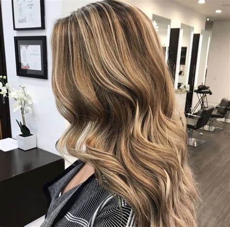 Warm Blonde Highlights With A Caramel Swirl Touch These Curls Look