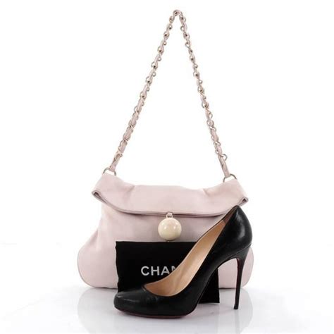 It can make or break an outfit. Chanel Cue Ball Foldover Bag Leather Medium at 1stdibs