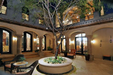 The great room is a guest room is quietly tucked away towards the front of the home with a full bath and access to the courtyard. Spanish Style Homes with Courtyards | Spanish Colonial ... | Maison espagnole, Plan maison, Maison