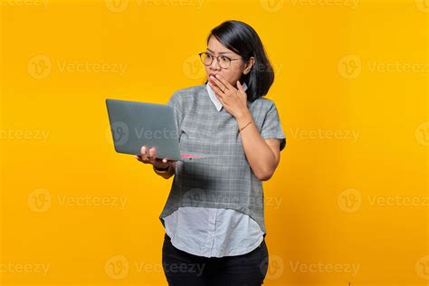 Asian Woman Wearing Glasses Surprised While Opening Incoming Email On