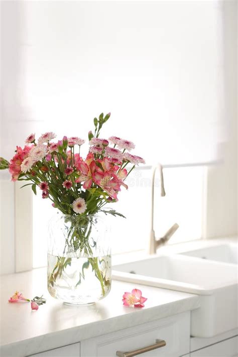 Vase With Beautiful Flowers On Kitchen Counter Stylish Element Of