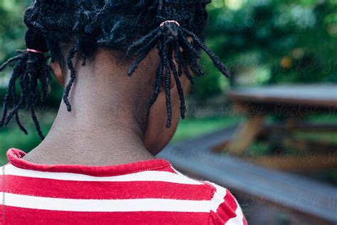 african american girl with red and white striped shirt by stocksy contributor gabi bucataru