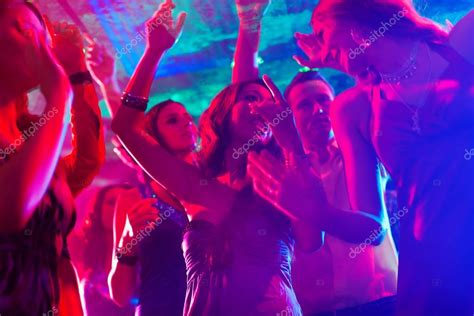 Party People Dancing In Disco Or Club — Stock Photo © Kzenon 79224070