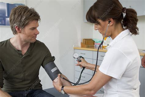 Doctor Taking Patients Blood Pressure Stock Image F0064469